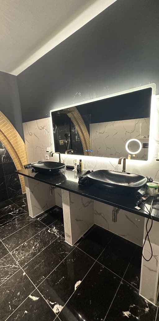 Mirror, furniture and sinks in bathroom after DEYA Construction work in Alkmaar